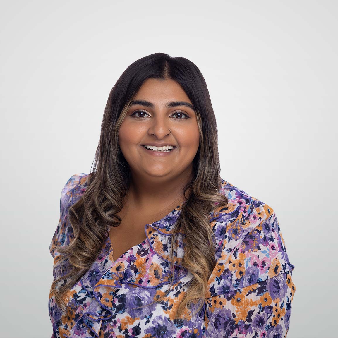 Professional headshot of Ilham Harjee, ATBIM