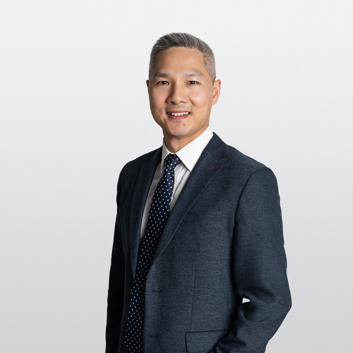 Professional headshot of Thang Phung, Investment Counselor in ATBIM